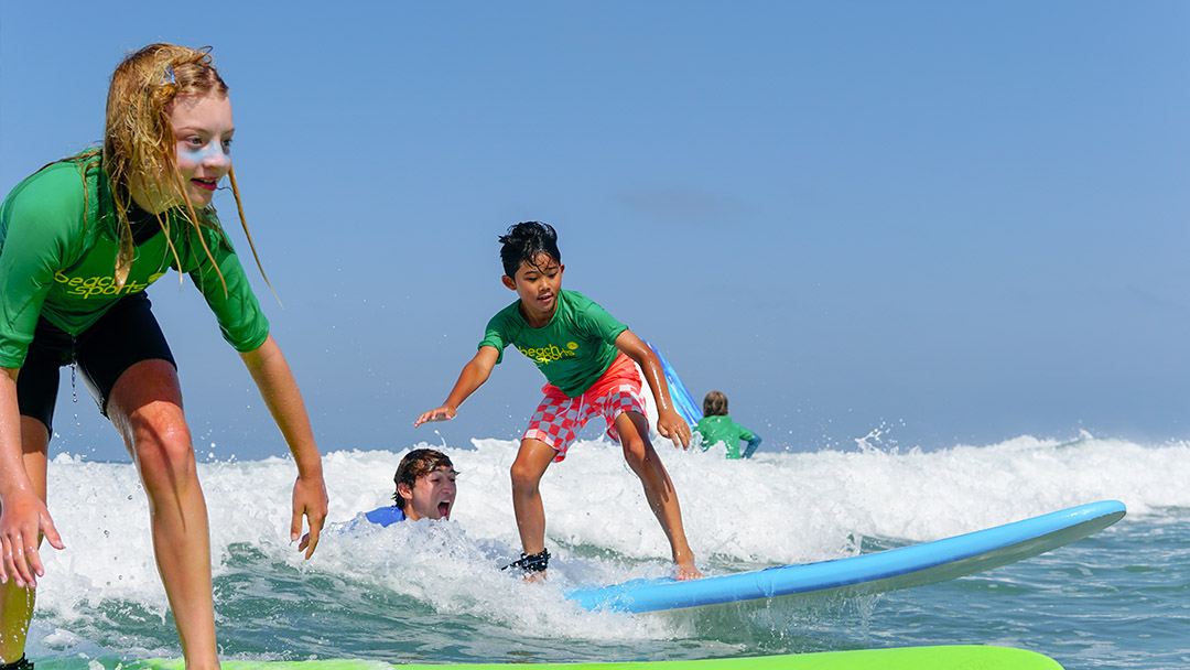 Kids learn to surf at Beach Sports kids surf camp in Manhattan Beach CA